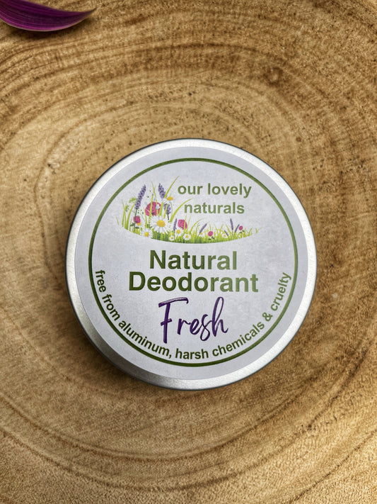 Tin of handmade fresh natural deodorant on a wooden board